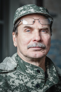 Portrait_of_Deputy_Commander_of_the_militia_Fedor_Berezin_with_the_Donetsk_Regional_State_Administration_on_background_on_june_21,_2014_in_Donetsk._002